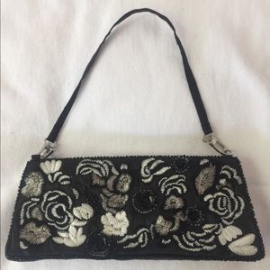 Black and maroon clutches/wristlets.